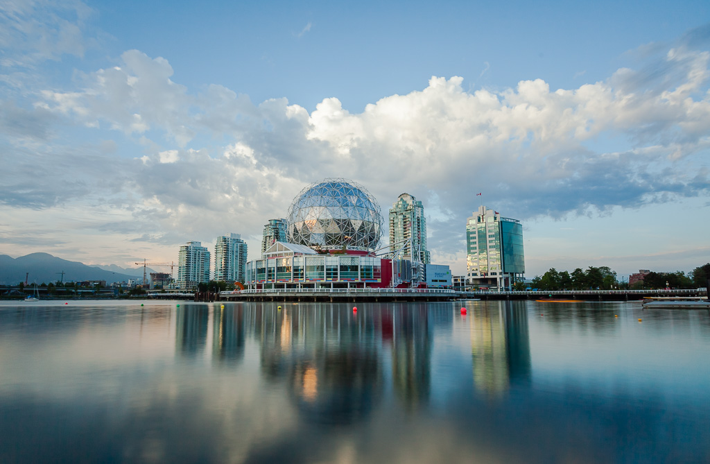 Sunset lit Science World (Telus World of Science) reflecting in False Creek, Vancouver, BC